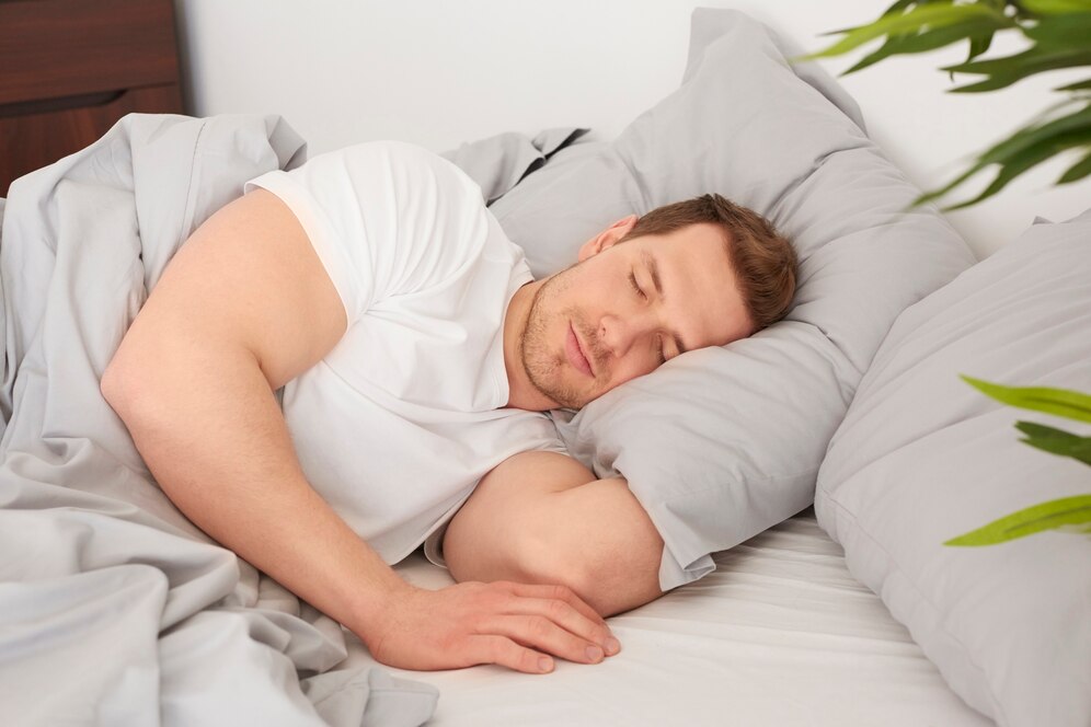 man-sleeping-comfortable-bed