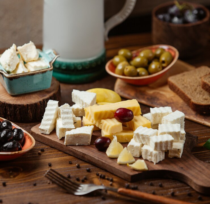 cheese-plate-with-white-gouda-cheese-grape-lemon