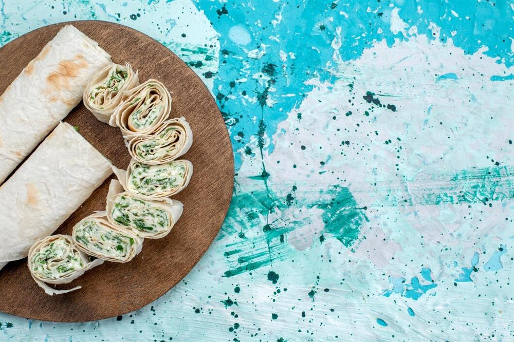 asty-vegetable-rolls-whole-sliced-with-greens-blue