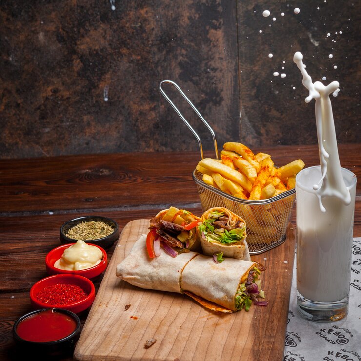 side-view-shawarma-with-fried-potatoes-ayran-splash-board-cookware